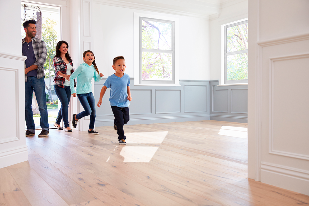 Mother and baby playing on a hardwood floor