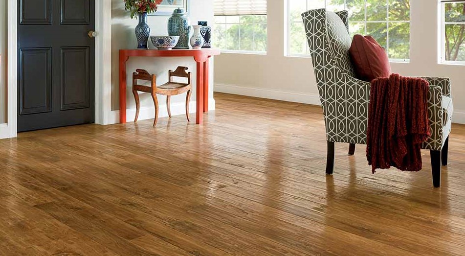 Bedroom with new oak hardwood flooring from Flooring America